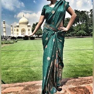 Elegant Green Sari with Gold Accents